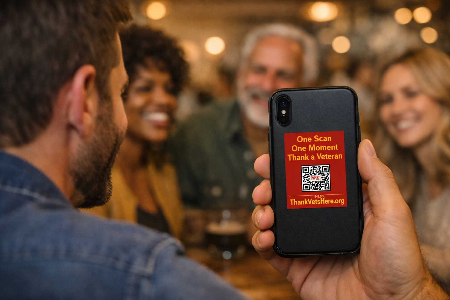 A group gathering around a phone to participate in ThankVetsHere