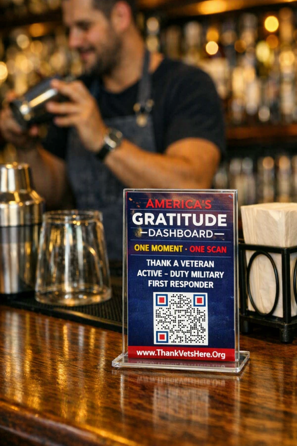 America's Gratitude Dashboard QR code displayed on a bar counter