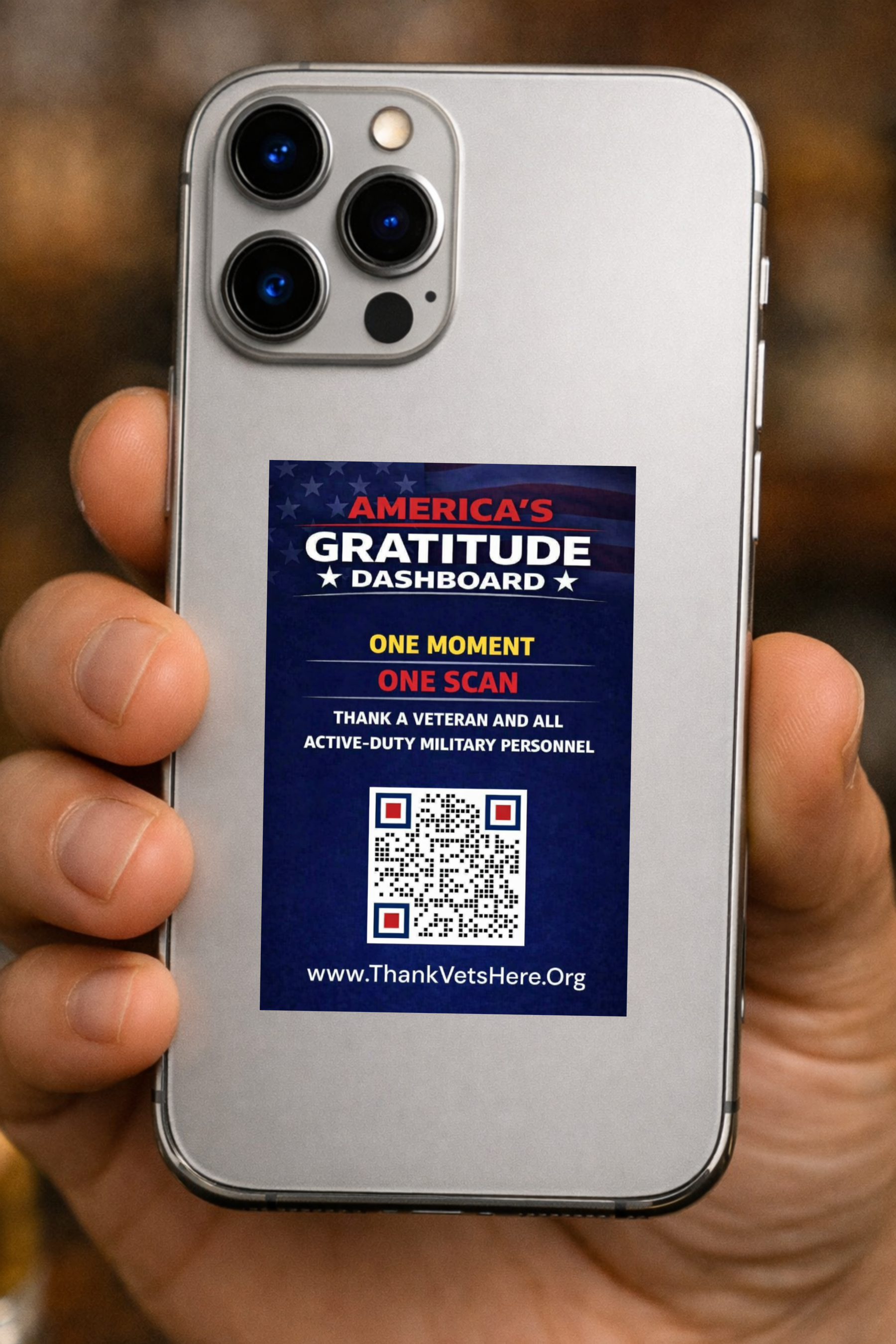 America's Gratitude Dashboard decal displayed on a phone held by a student